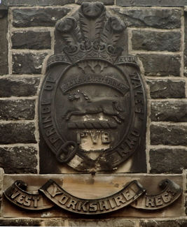 Harrogate - Detail of insignia of west Yorkshire Reg at apex of gable
